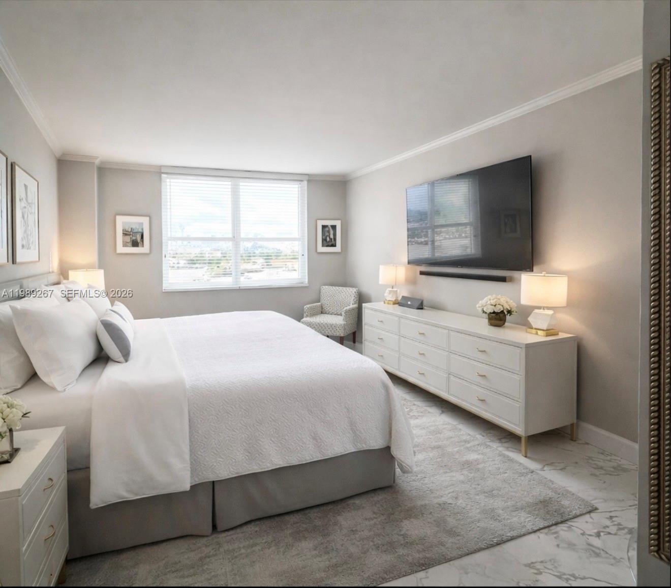 90 Alton Road, Unit 803 Miami Beach, FL 33139 - Photo 6 of 23 a bedroom with a bed and a flat screen tv