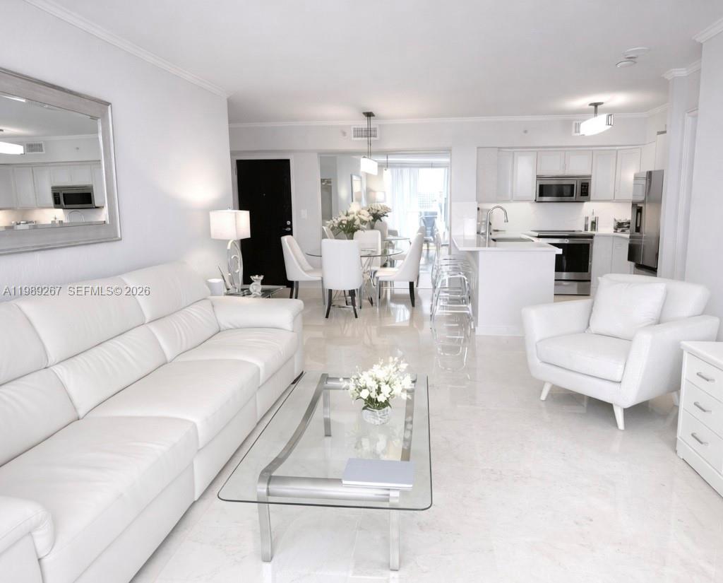 90 Alton Road, Unit 803 Miami Beach, FL 33139 - Photo 8 of 23 a living room with furniture and white walls