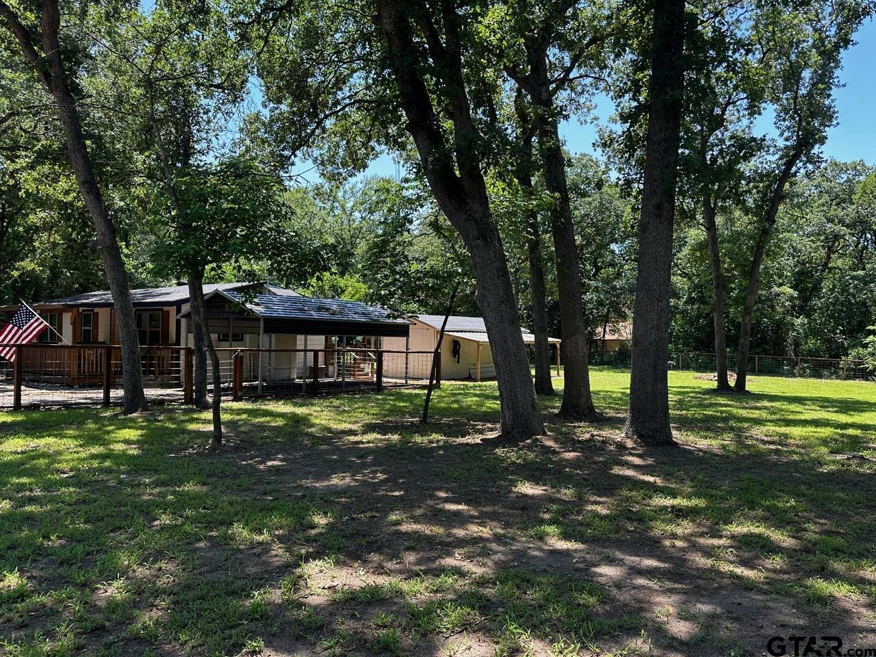 223 Holly Glen Murchison, TX 75778 - Photo 25 of 34 a house with a tree in the background