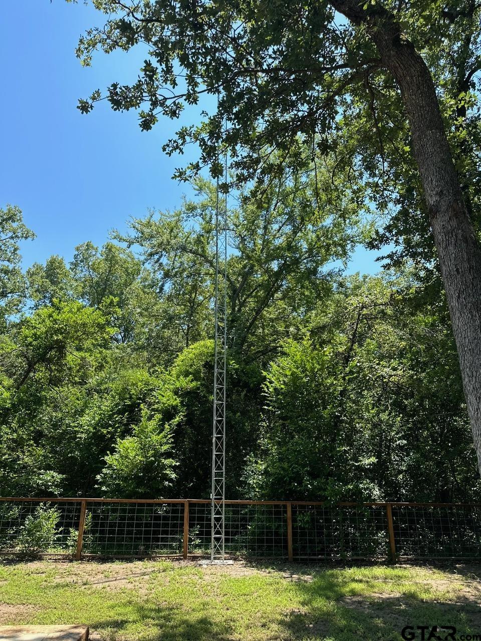 223 Holly Glen Murchison, TX 75778 - Photo 30 of 34 a view of a large trees with wooden fence