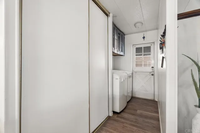 a view of hall way with furniture and windows