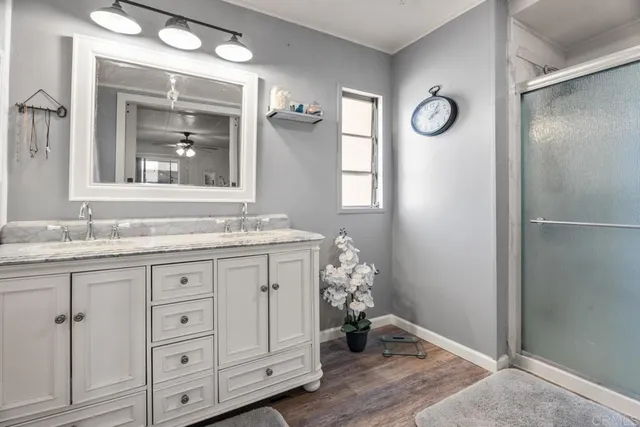 a white toilet sitting next to a bathroom sink