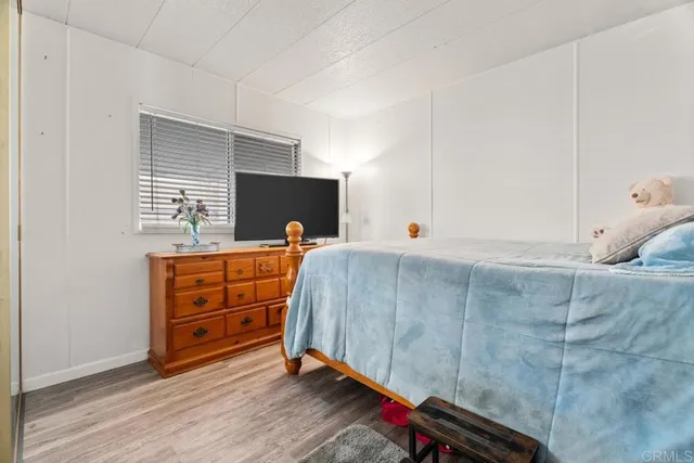 a bathroom with a sink a toilet and shower curtain