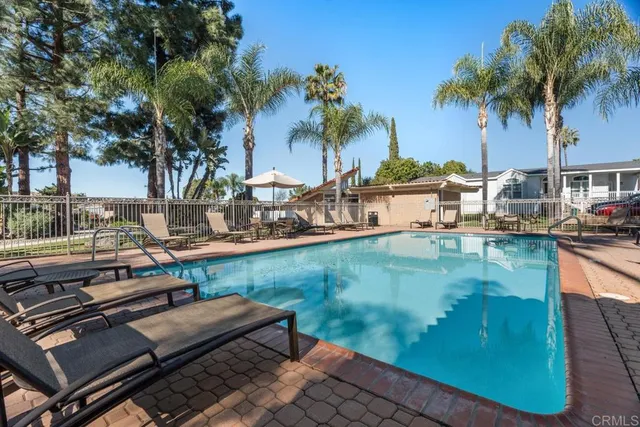 a view of a swimming pool with a patio