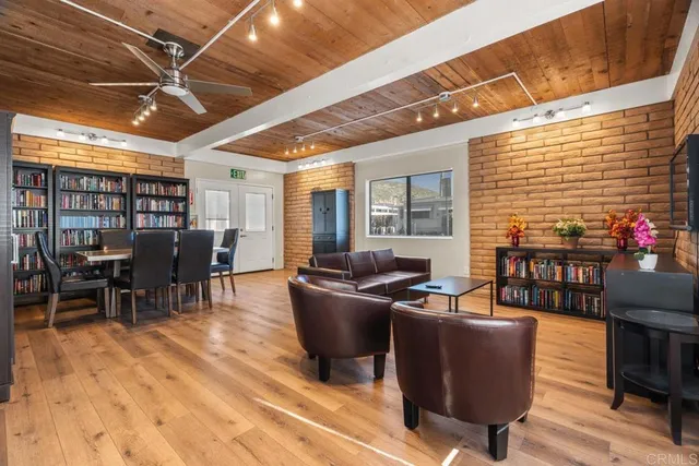 a backyard of a house with wooden floor outdoor seating and stairs