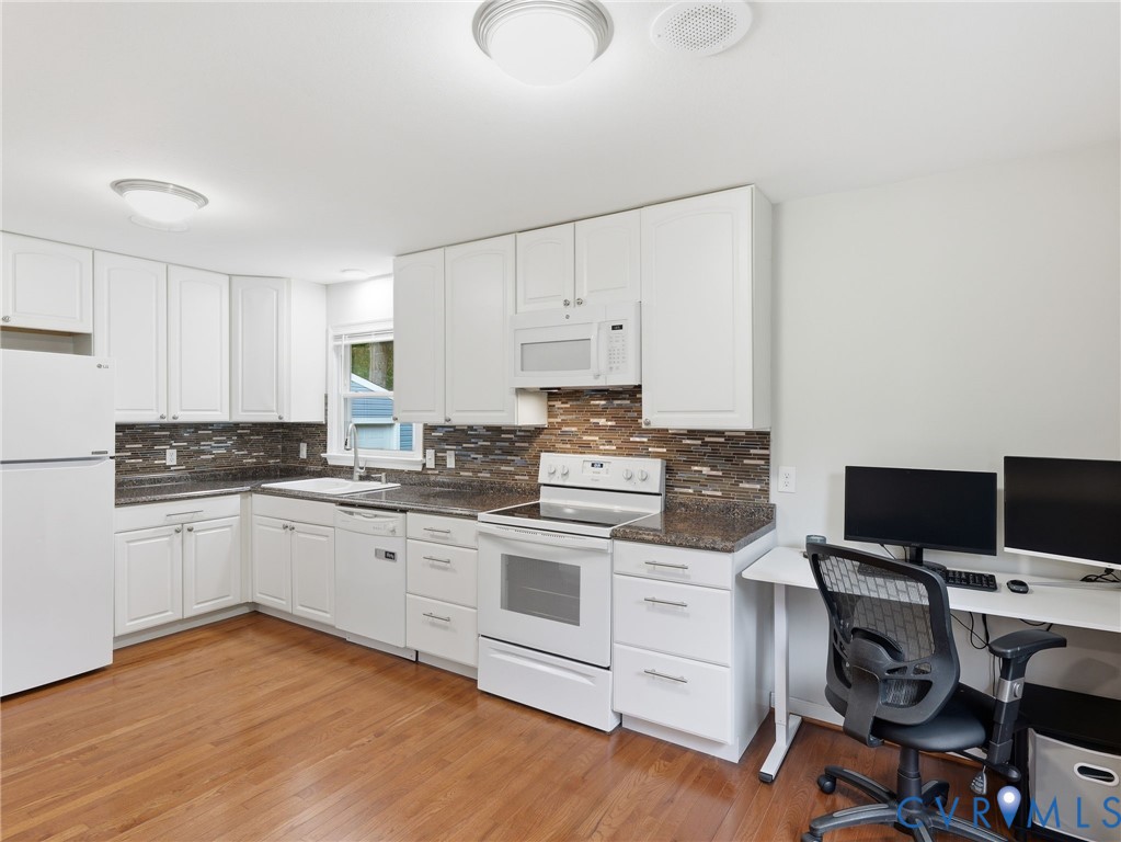 7707 Woodbrook Road Quinton, VA 23141 - Photo 6 of 42 Kitchen area with wood-finish flooring, white cabi