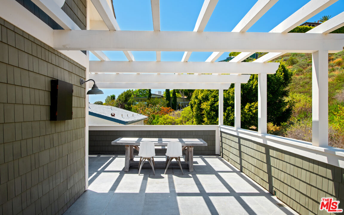 25157 Malibu Road Malibu, CA 90265 - Photo 19 of 33 a view of a chairs and table in patio