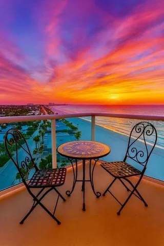 a view of a chairs and table in patio
