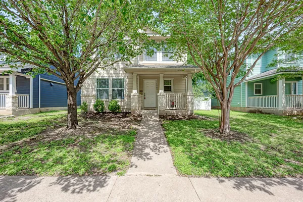 front view of a house with a garden