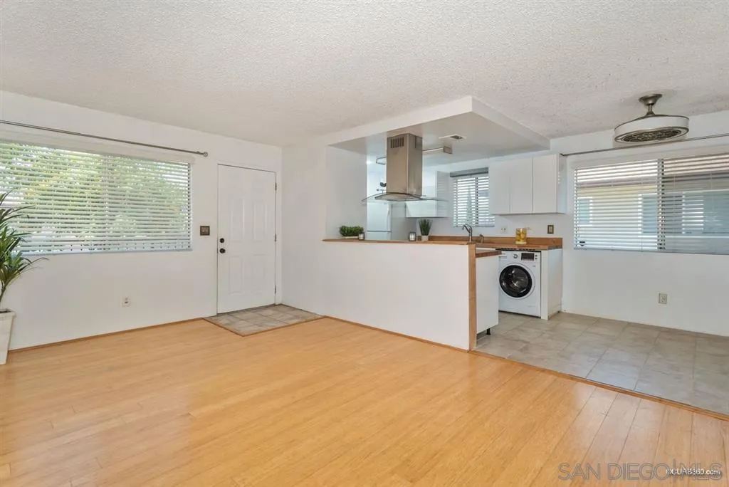 9845 Mission Gorge Road, Unit 4 Santee, CA 92071 - Photo 8 of 25 a kitchen with a sink a stove and cabinets