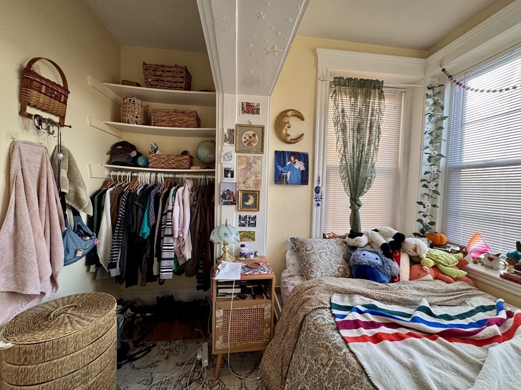 50 Chester Street, Unit 10 Boston, MA 02134 - Photo 11 of 13 a bedroom with a bed and a window