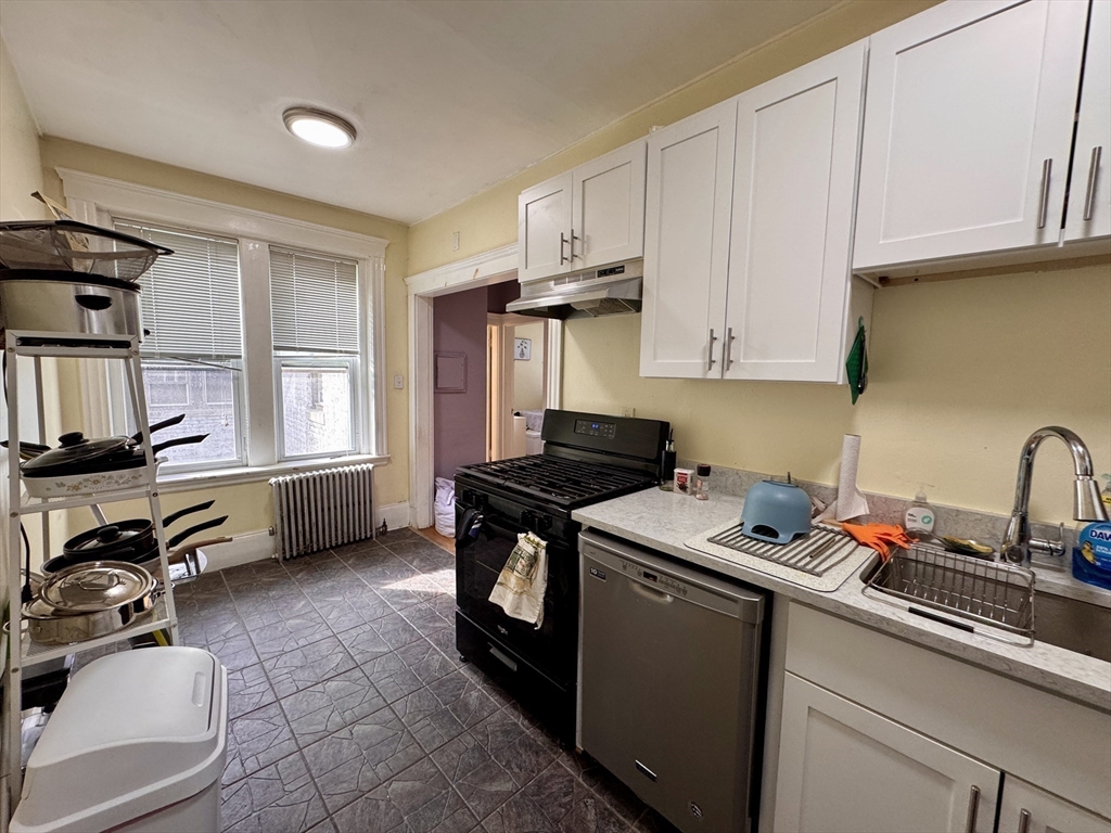 50 Chester Street, Unit 10 Boston, MA 02134 - Photo 4 of 13 a kitchen with a sink appliances and cabinets