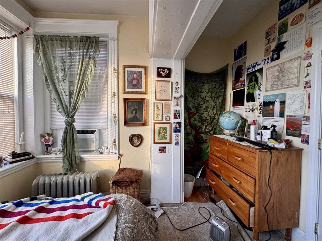 50 Chester Street, Unit 10 Boston, MA 02134 - Photo 10 of 13 a bedroom with furniture and a window