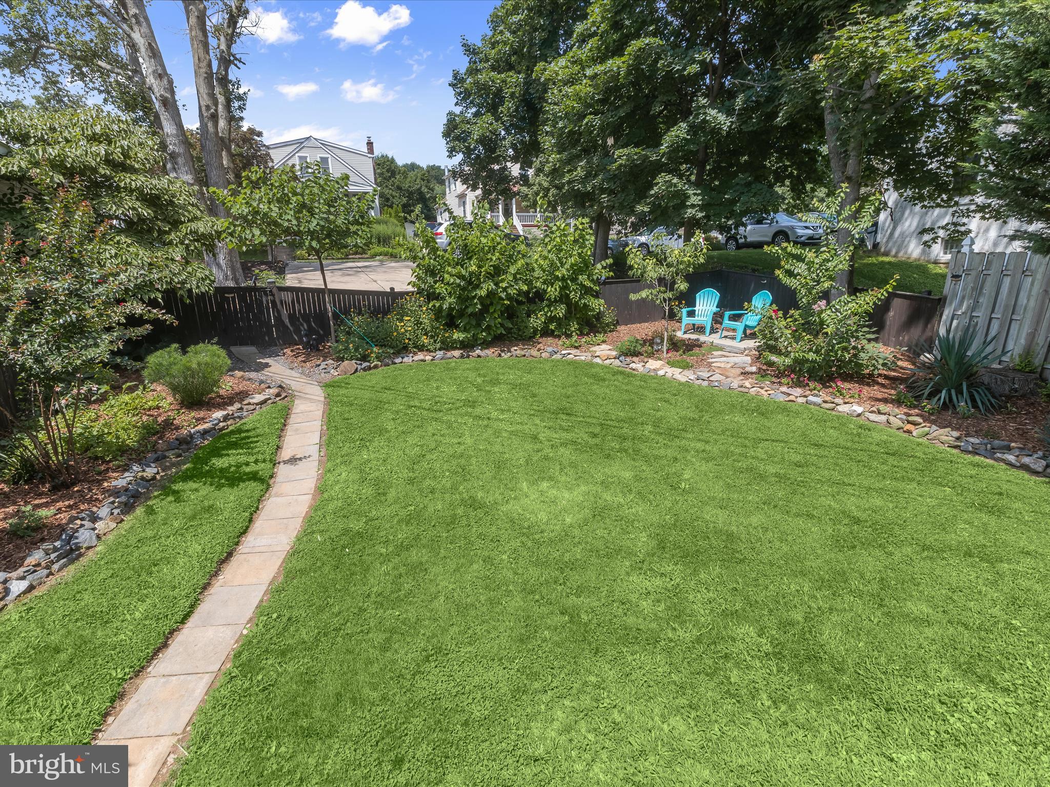8 Edmondson Ridge Road Catonsville, MD 21228 - Photo 37 of 50 a view of a garden with a bench