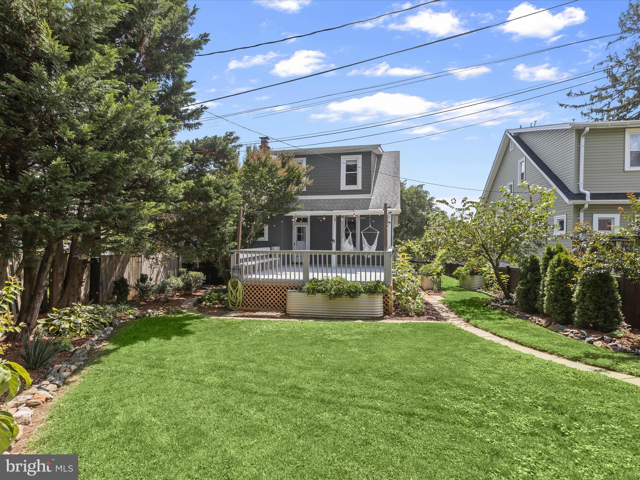 8 Edmondson Ridge Road Catonsville, MD 21228 - Photo 44 of 50 a view of house with a big yard and potted plants