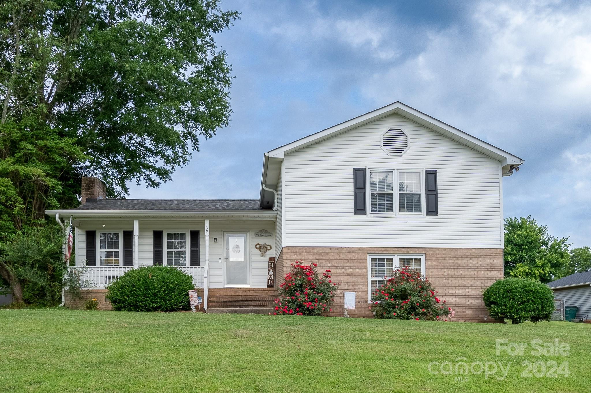 130 Log Barn Road Salisbury, NC 28146 - Photo 1 of 22 a front view of a house with a garden and plants