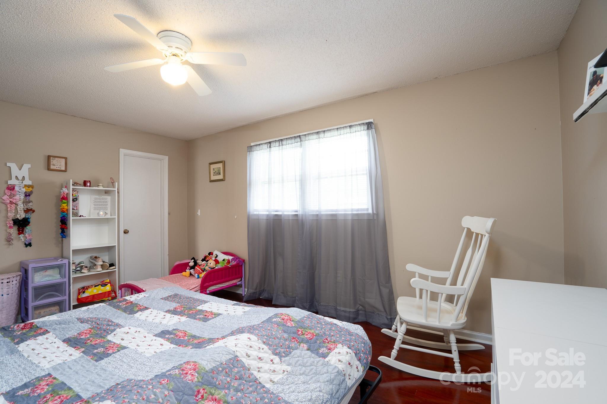 130 Log Barn Road Salisbury, NC 28146 - Photo 12 of 22 a bedroom that has a bed and a chair in it