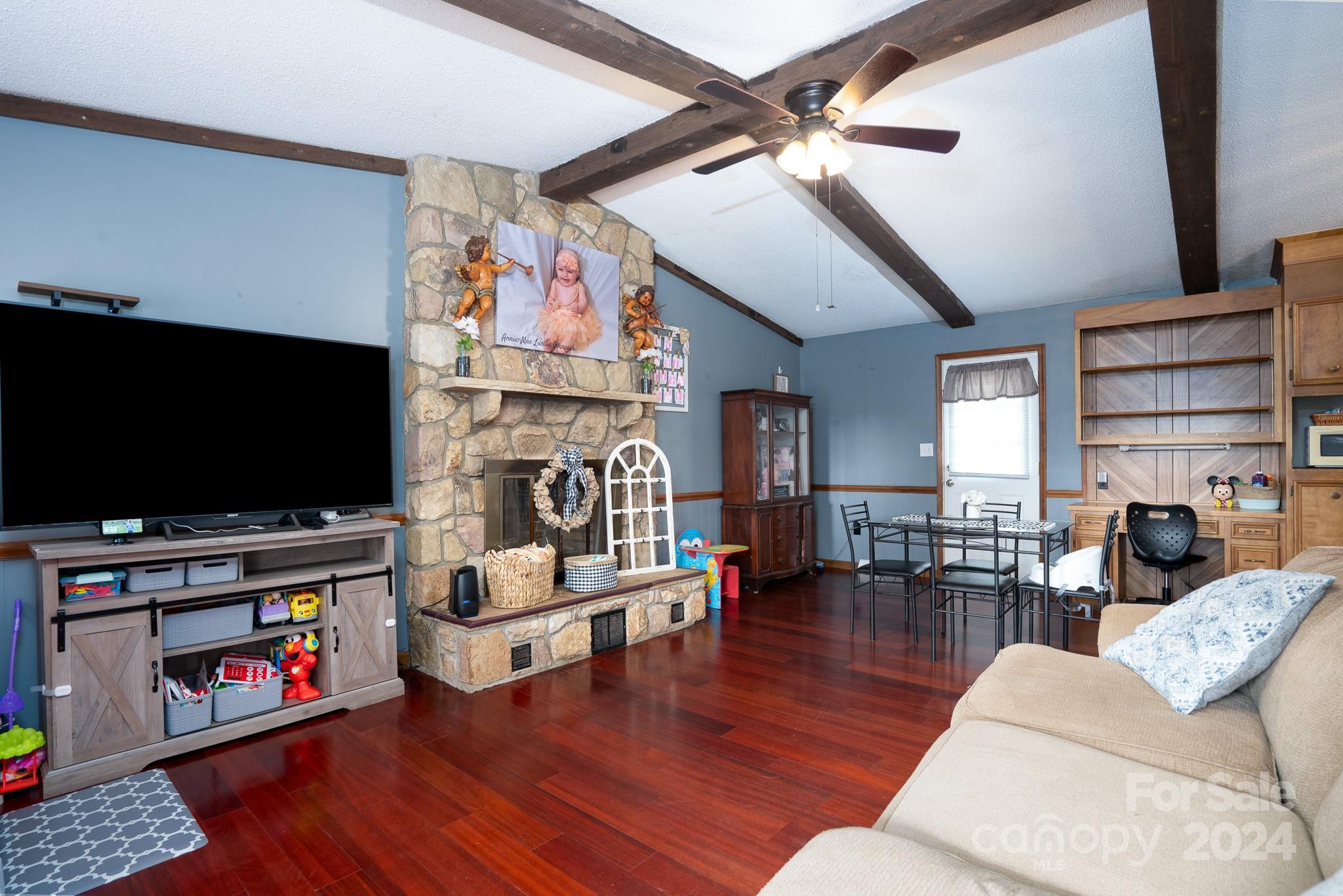 130 Log Barn Road Salisbury, NC 28146 - Photo 3 of 22 a living room with furniture and a flat screen tv
