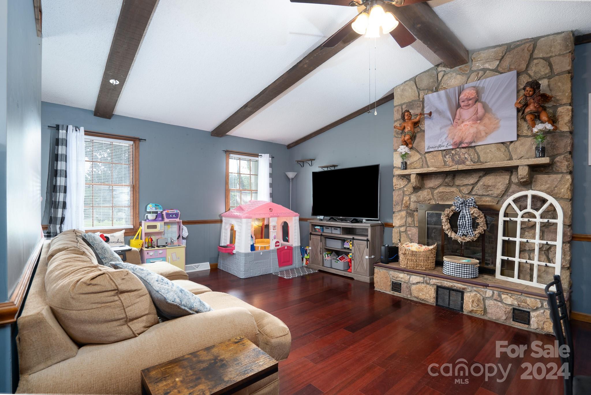 130 Log Barn Road Salisbury, NC 28146 - Photo 4 of 22 a living room with furniture and a flat screen tv