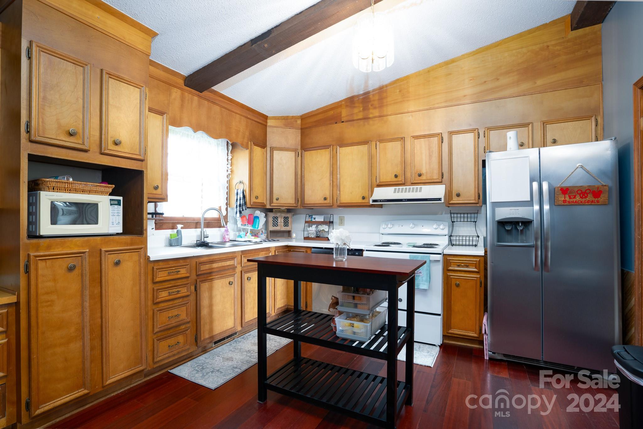 130 Log Barn Road Salisbury, NC 28146 - Photo 5 of 22 a kitchen with stainless steel appliances granite countertop a refrigerator a sink dishwasher a stove with wooden cabinets and floor