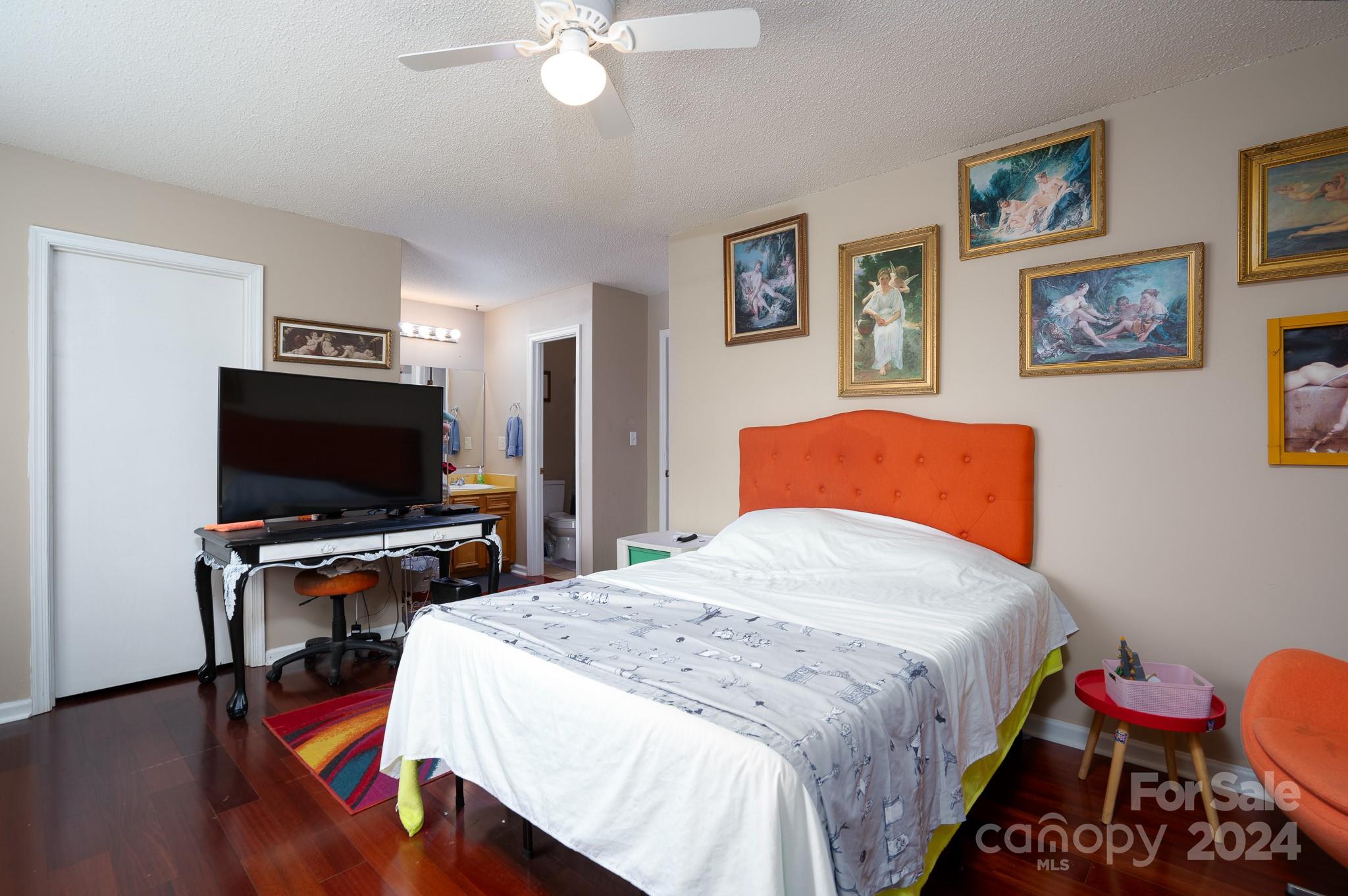 130 Log Barn Road Salisbury, NC 28146 - Photo 9 of 22 a bedroom with bed and a flat screen tv