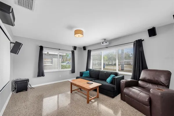a living room with furniture and a large window