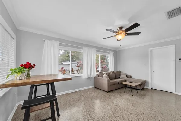 a living room with furniture and a window