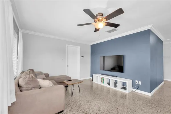 a living room with furniture and a flat screen tv