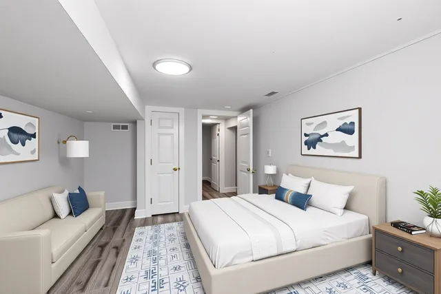 a spacious bedroom with a bed and a couch