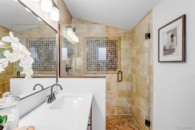 a bathroom with a sink and a shower