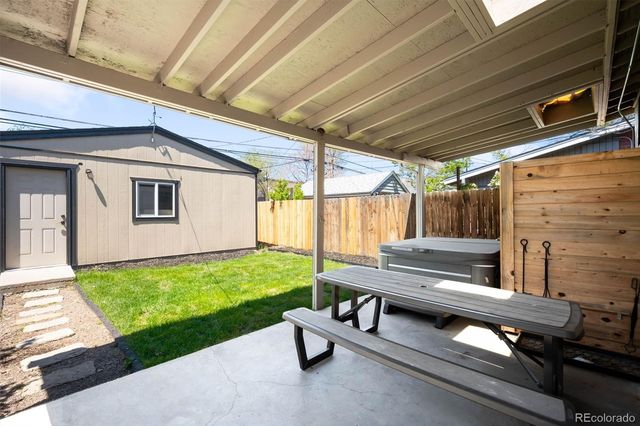 a view of a house with backyard and porch