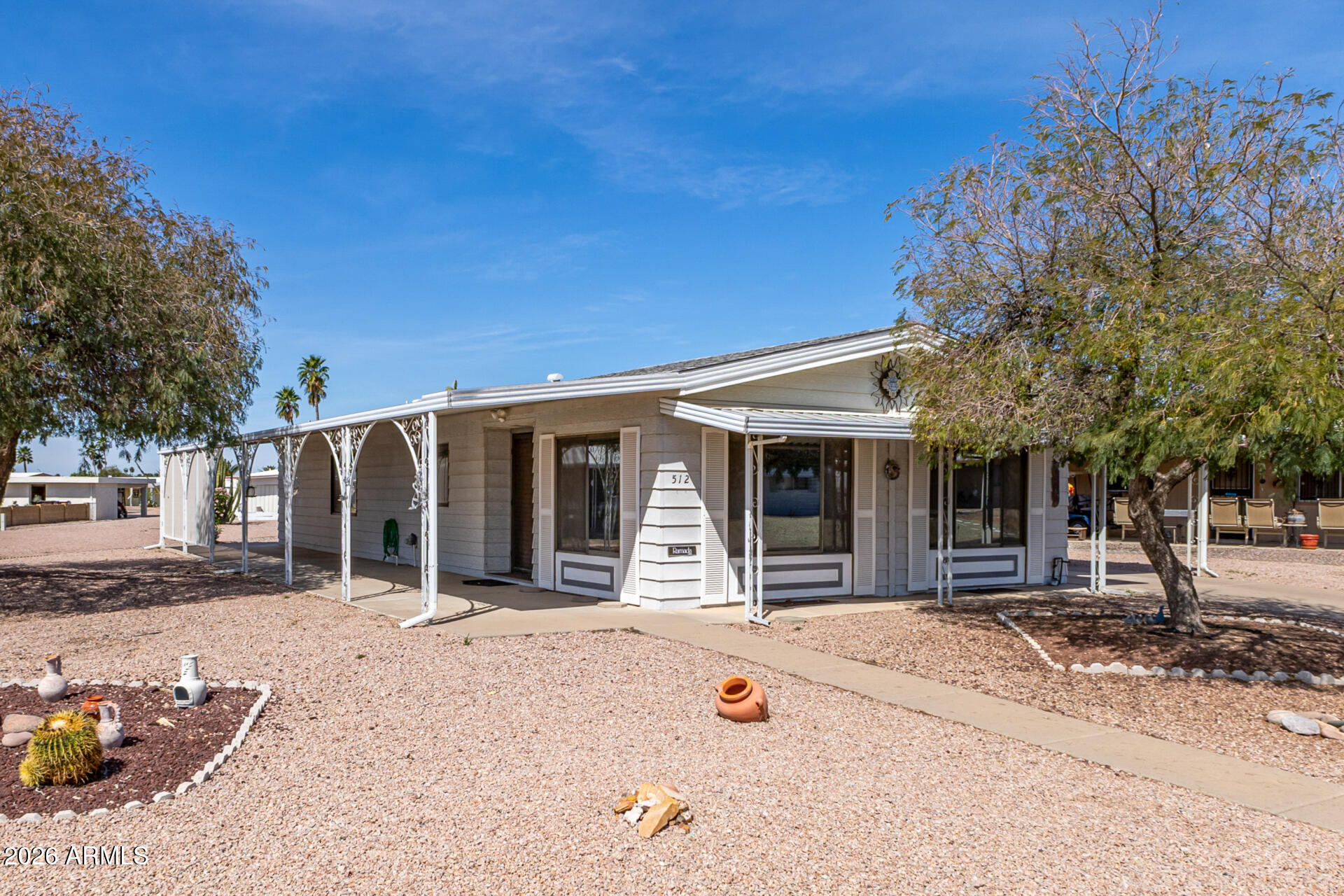 512 South 83rd Way Mesa, AZ 85208 - Photo 11 of 45 a view of a house with a patio