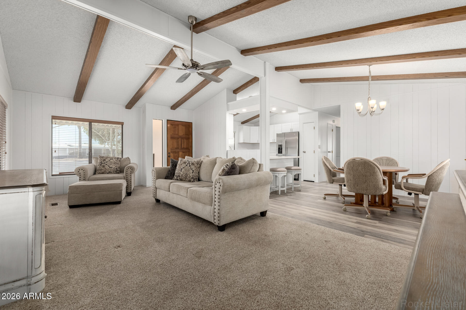 512 South 83rd Way Mesa, AZ 85208 - Photo 15 of 45 a living room with furniture and a chandelier