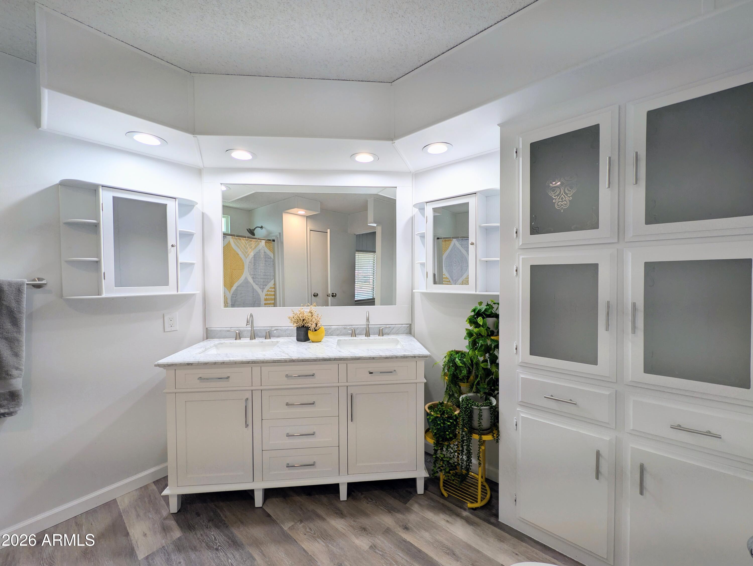 512 South 83rd Way Mesa, AZ 85208 - Photo 26 of 45 a bathroom with a double vanity sink and mirror