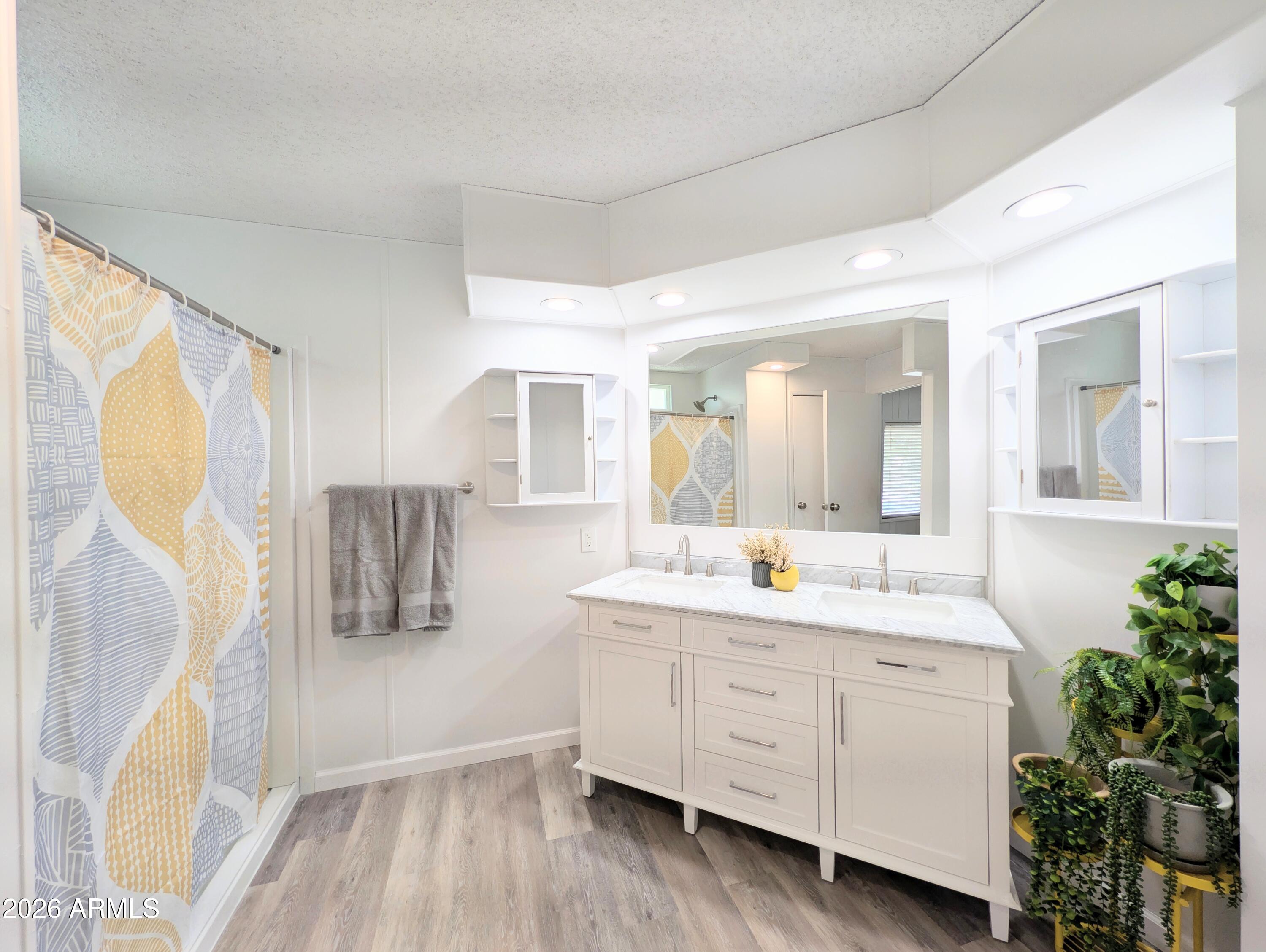 512 South 83rd Way Mesa, AZ 85208 - Photo 29 of 45 a bathroom with a double vanity sink mirror and shower