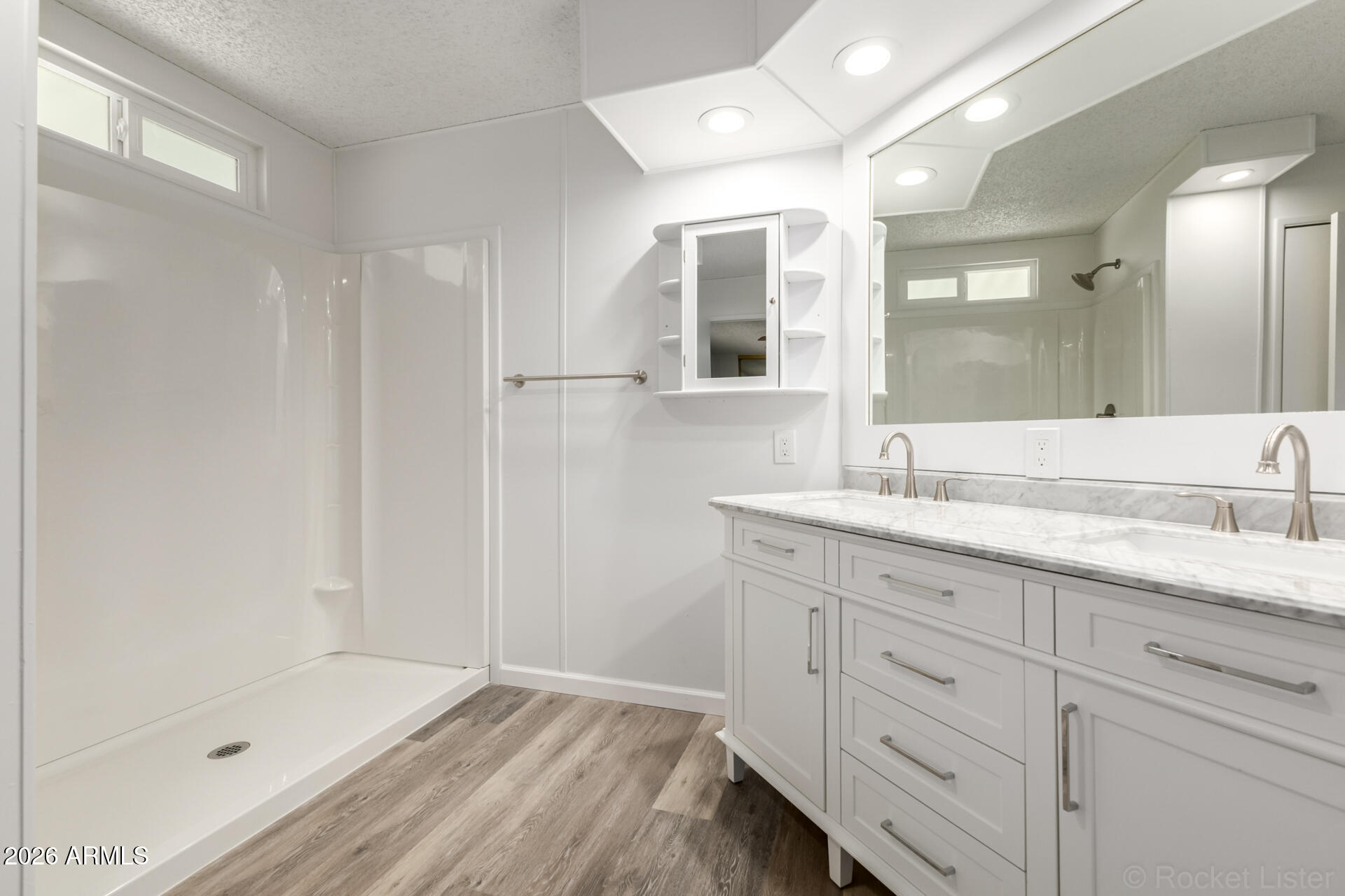 512 South 83rd Way Mesa, AZ 85208 - Photo 30 of 45 a bathroom with a shower sink and mirror