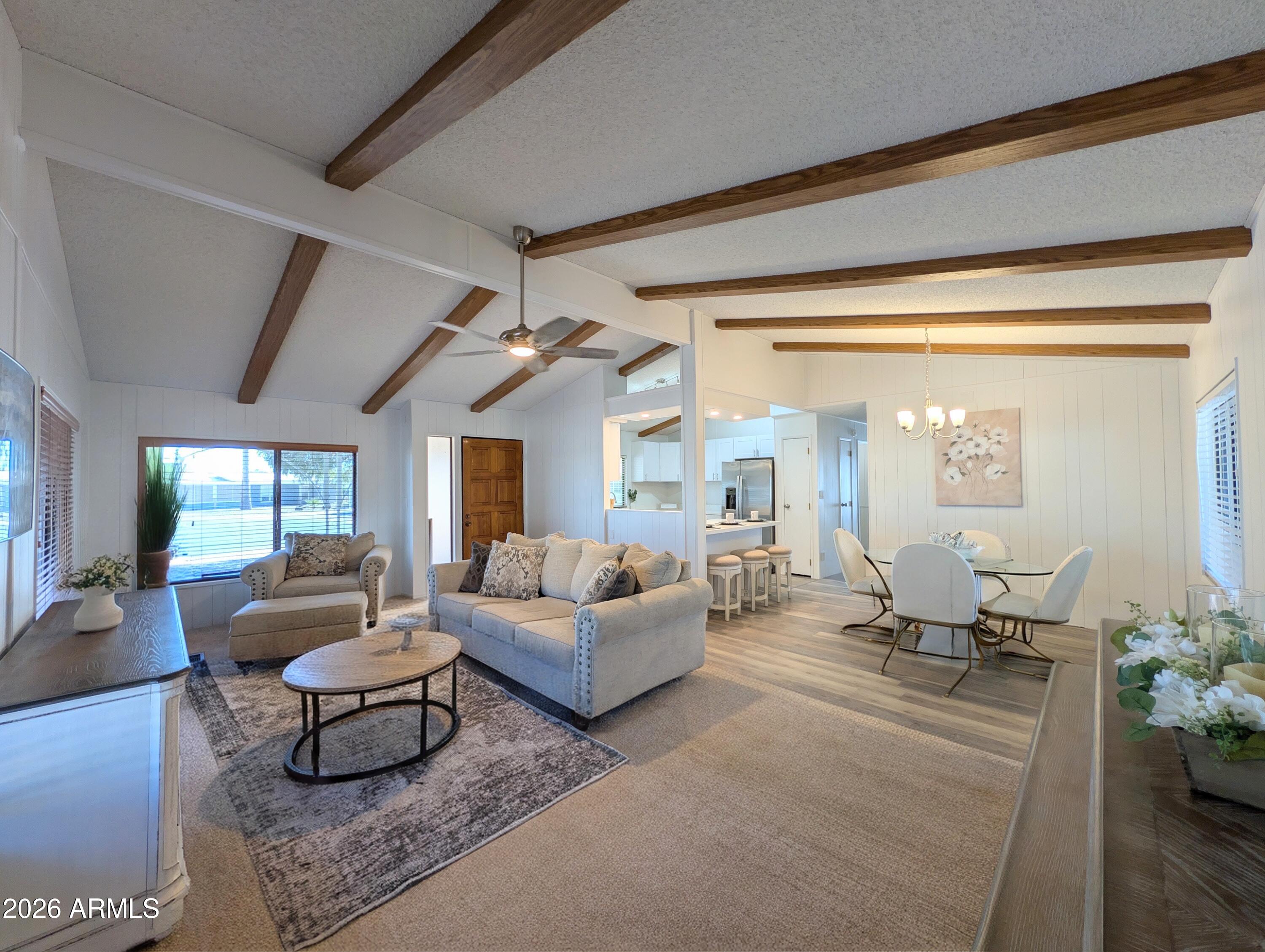 512 South 83rd Way Mesa, AZ 85208 - Photo 3 of 45 a living room with furniture potted plant and large windows