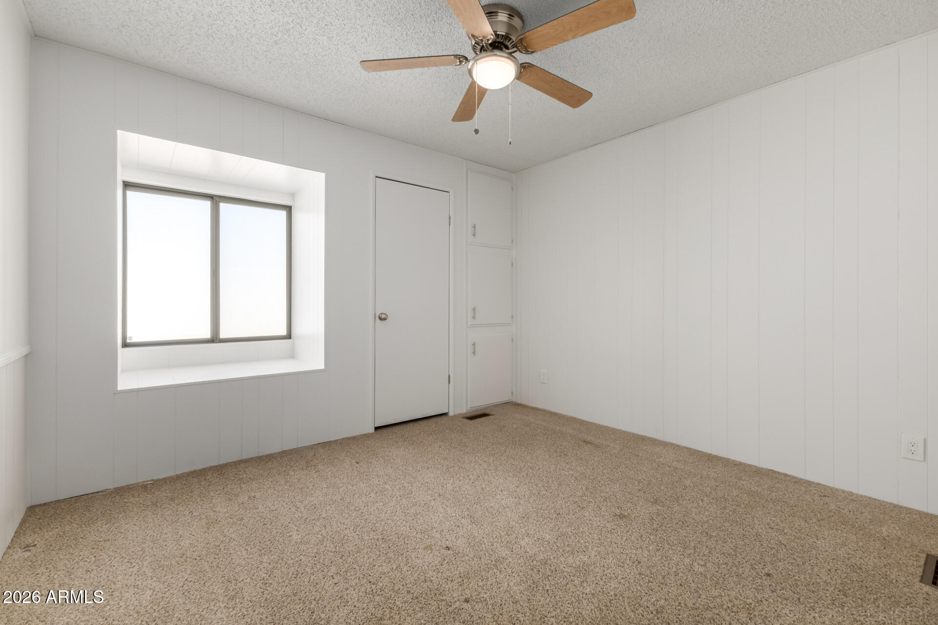 512 South 83rd Way Mesa, AZ 85208 - Photo 34 of 45 a view of an empty room with a window