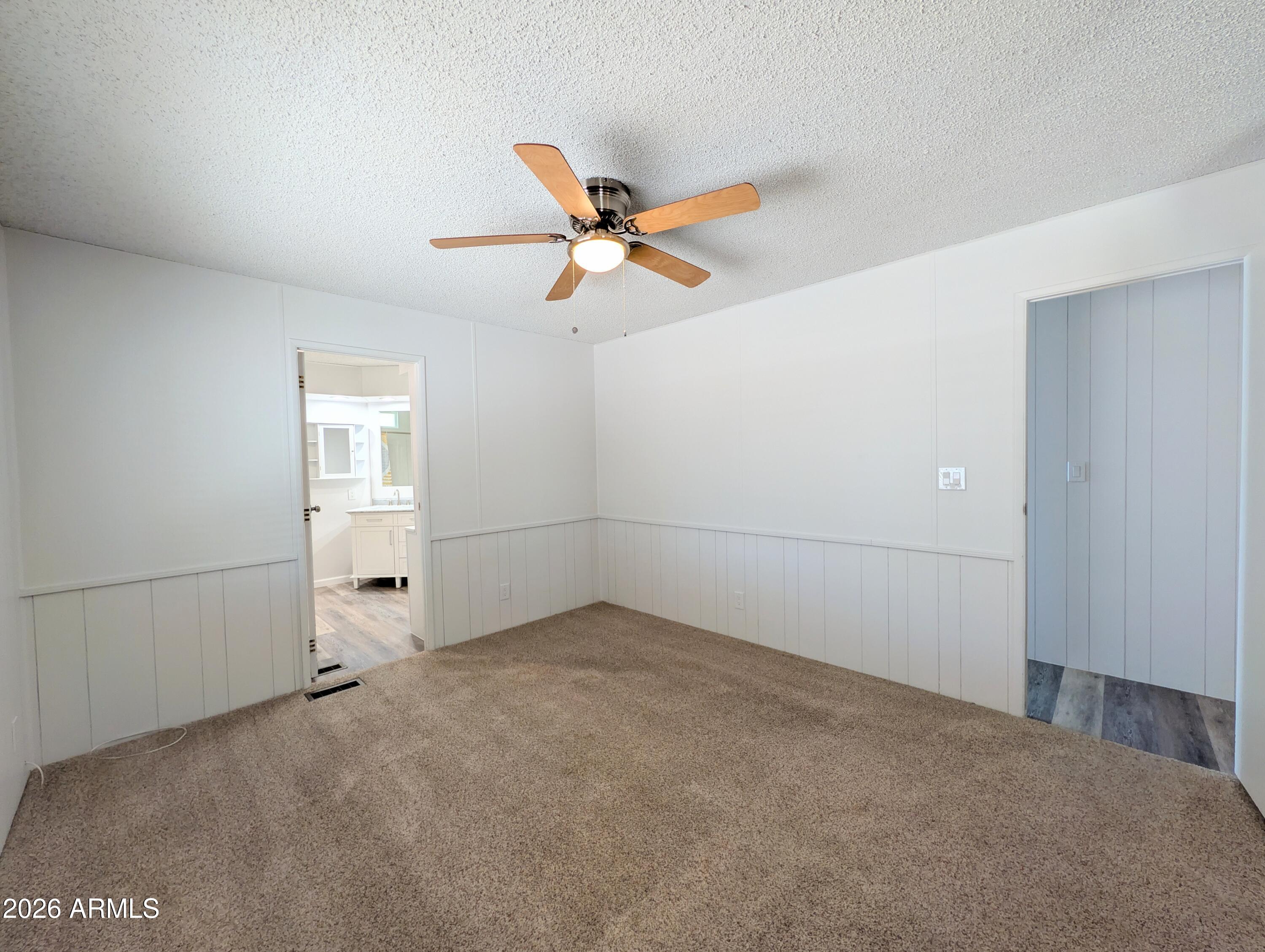 512 South 83rd Way Mesa, AZ 85208 - Photo 38 of 45 an empty room with closet and windows