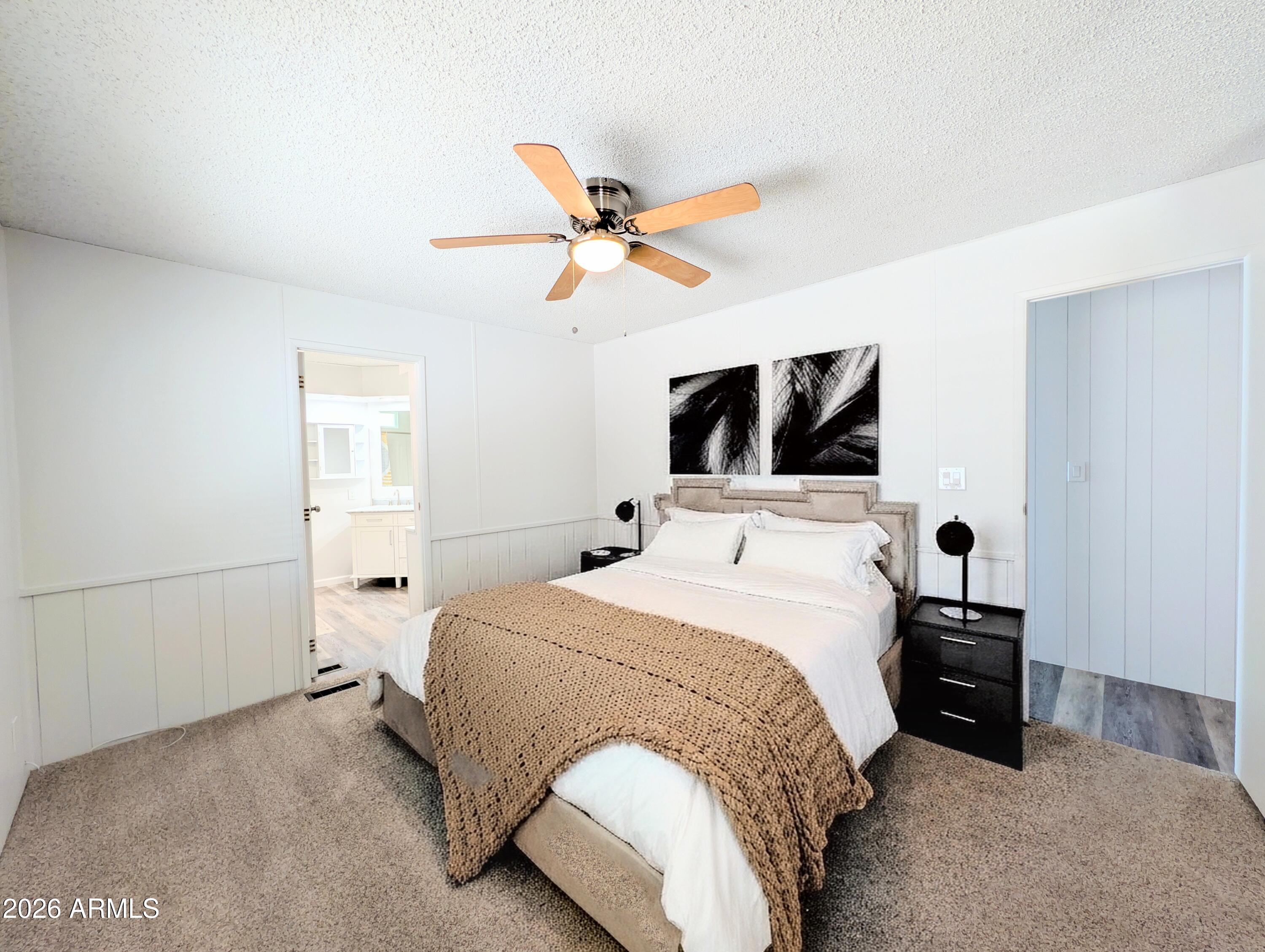 512 South 83rd Way Mesa, AZ 85208 - Photo 39 of 45 a bedroom with a bed and a flat tv screen