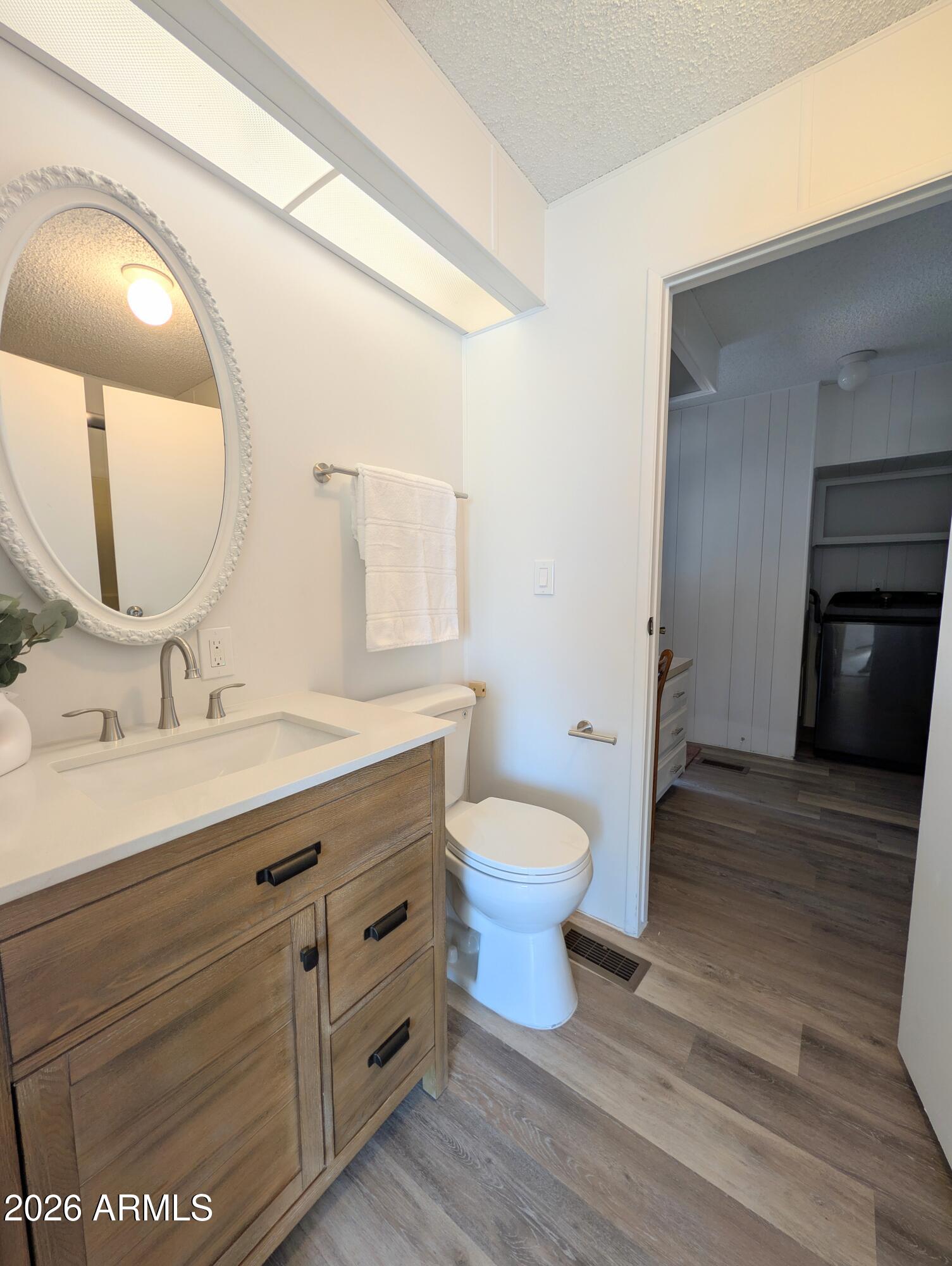 512 South 83rd Way Mesa, AZ 85208 - Photo 43 of 45 a bathroom with a toilet sink and mirror