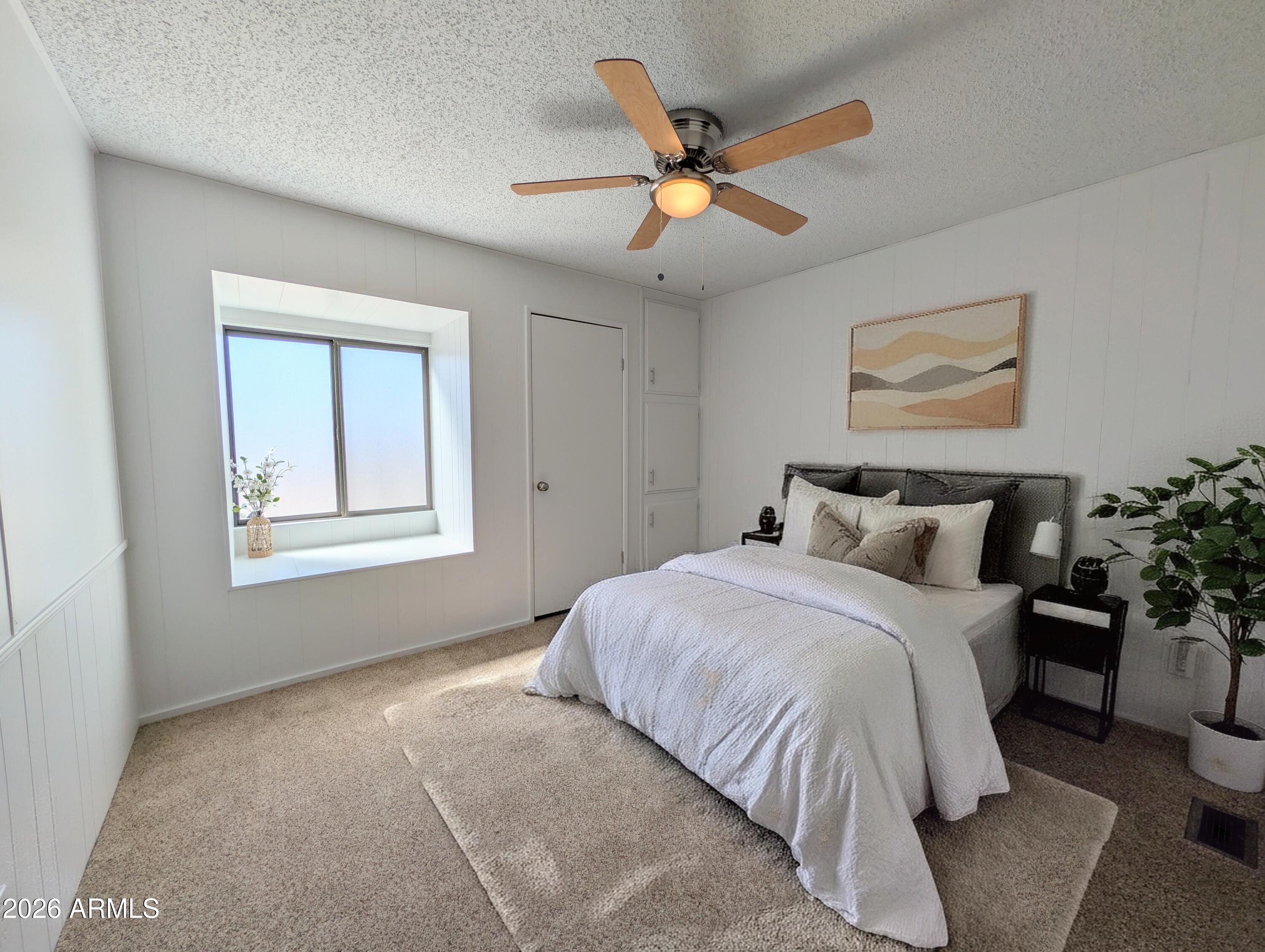 512 South 83rd Way Mesa, AZ 85208 - Photo 7 of 45 a bedroom with bed and a window