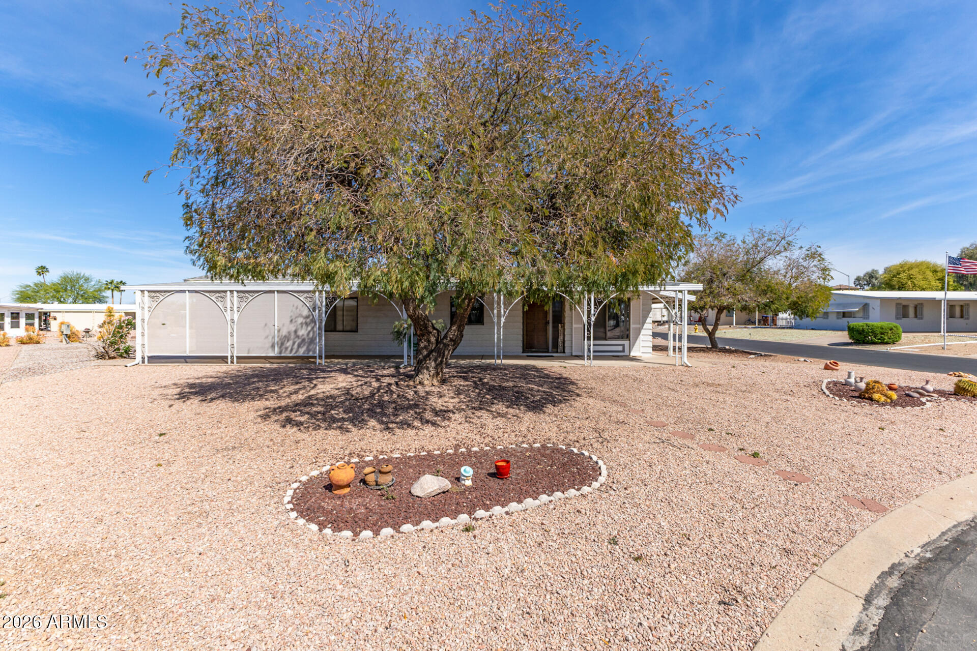 512 South 83rd Way Mesa, AZ 85208 - Photo 8 of 45 a view of a yard with a tree
