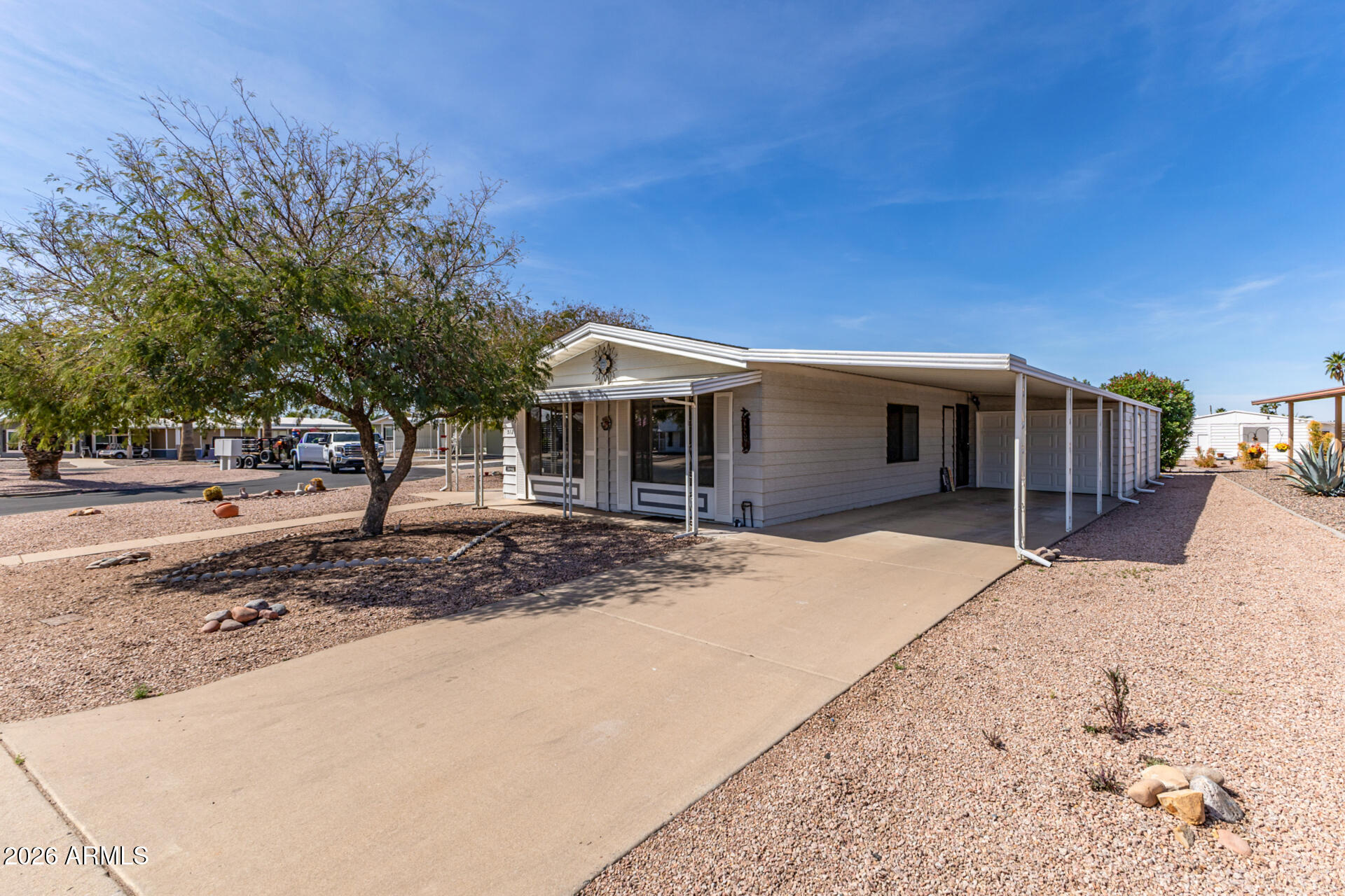 512 South 83rd Way Mesa, AZ 85208 - Photo 10 of 45 a house with trees in front of it