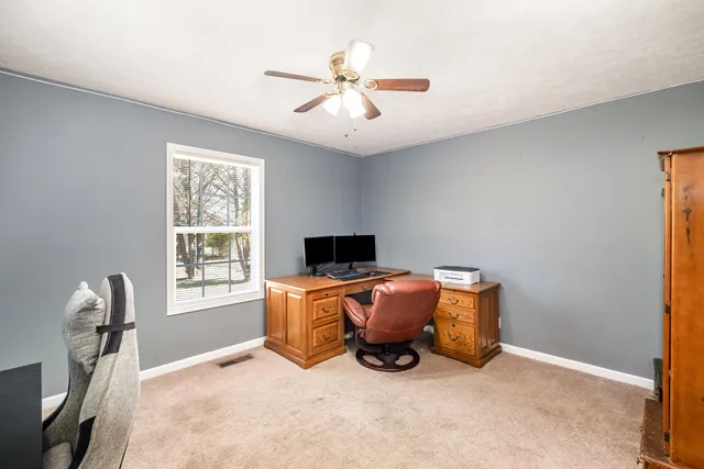 a workspace with furniture and window