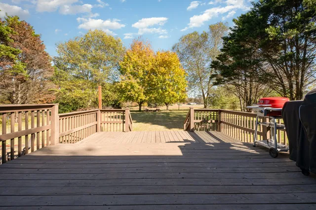 a view of deck with mountain and wooden floor