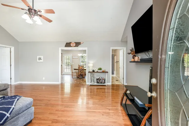 a living room with furniture and a flat screen tv