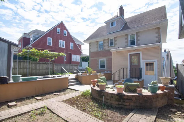 a view of a patio with couches table and chairs