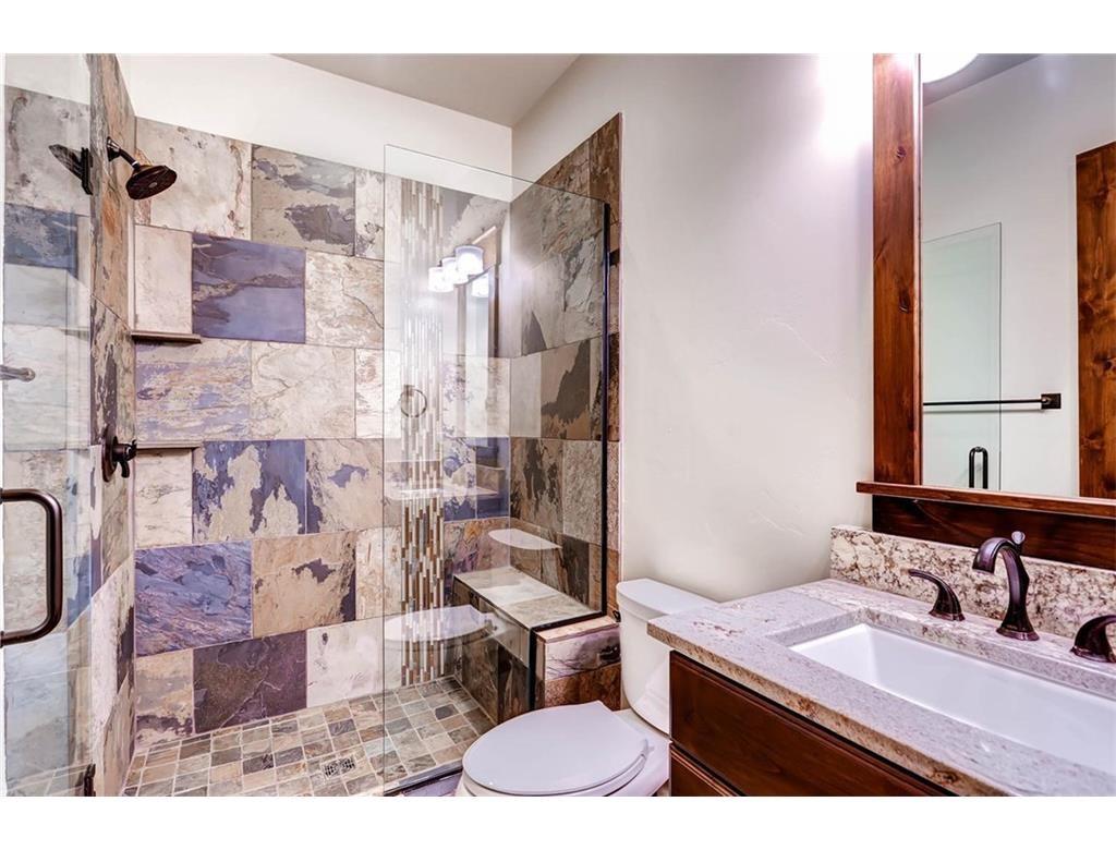 55 Brooks Snider Road Breckenridge, CO 80424 - Photo 22 of 35 a bathroom with a granite countertop sink a toilet and a mirror