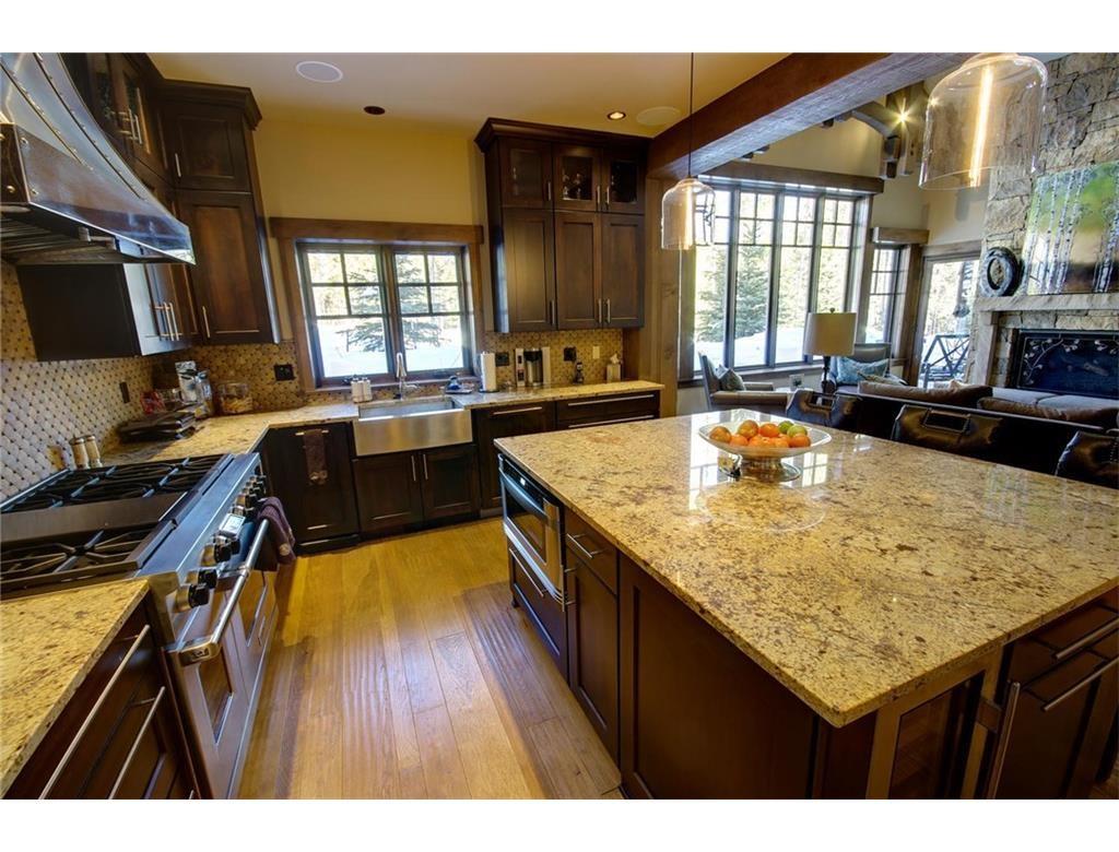 55 Brooks Snider Road Breckenridge, CO 80424 - Photo 26 of 35 a kitchen with a stove a sink and a wooden cabinets